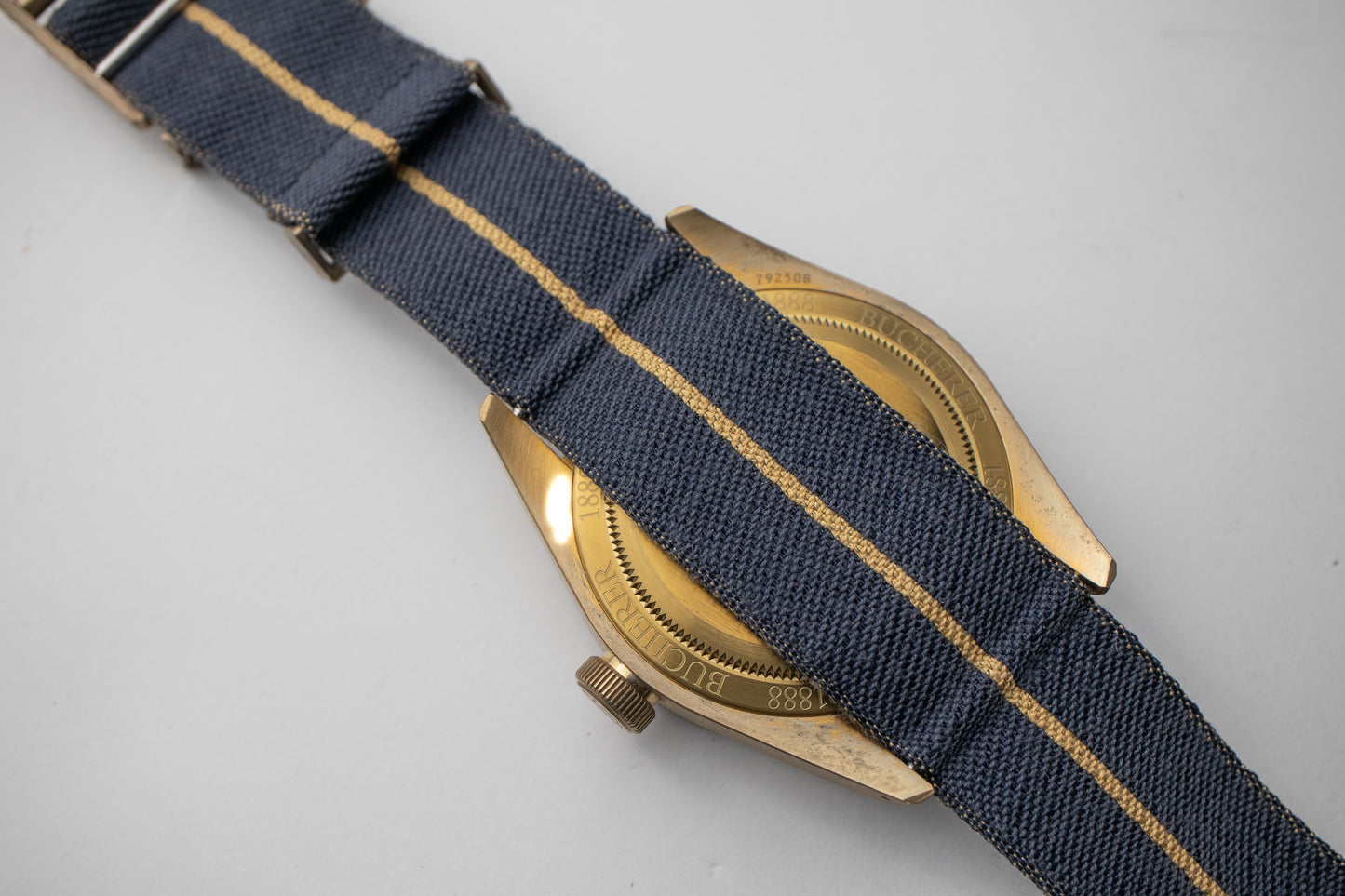 Tudor Black Bay Bronze Bucherer Blue dial reference 79250BB fabric nato strap and bronze caseback of the watch