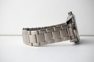 Grand Seiko SBGA147 titanium men's watch with a white dial bracelet