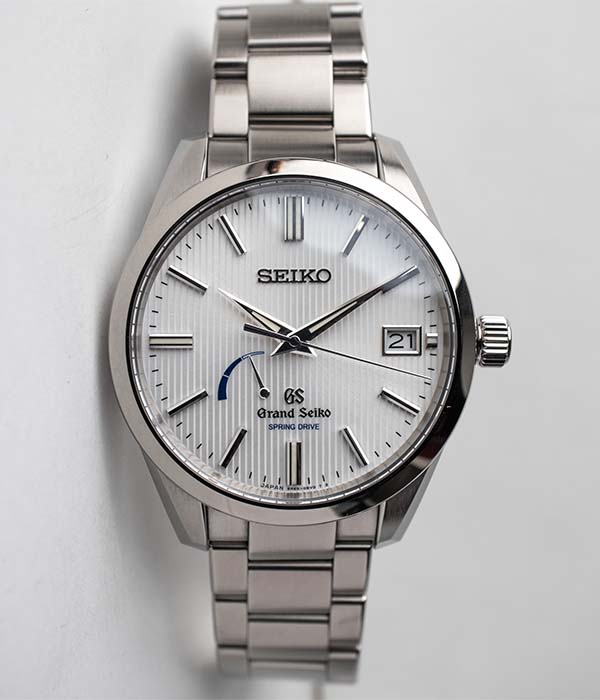 Grand Seiko SBGA147 titanium men's watch with a white dial for sale by Belmont Watches in San Diego