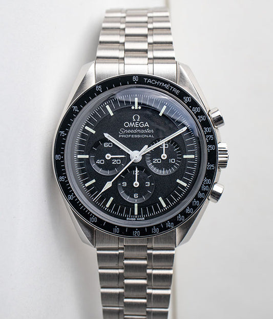 Omega Speedmaster Moonwatch referance 310.30.42.50.01.001 Hesalite crystal black dial chronograph stainless steel men's watch front of the watch for sale by Belmont Watches in San Diego