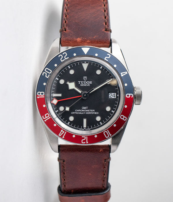 Tudor Black Bay GMT Pepsi reference 79830RB men's automatic watch on a brown leather strap for sale by Belmont Watches in San Diego