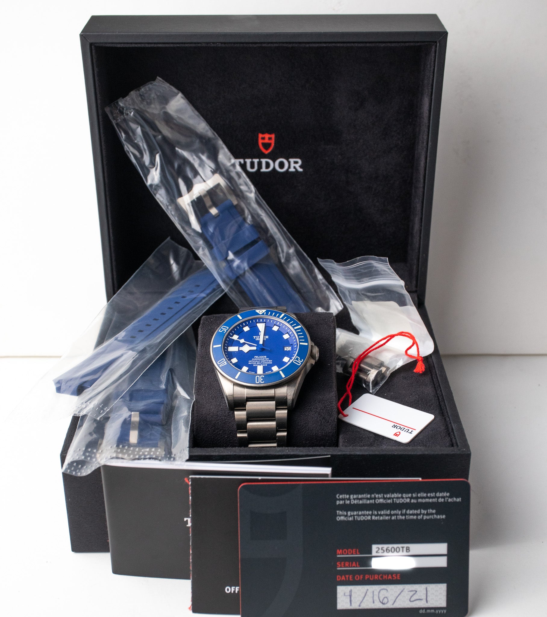 Tudor Pelagos Blue reference 25600TB box, booklets, warranty card dated 2021, hang tag, watch, and extra blue rubber strap